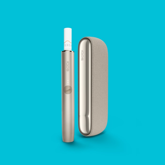 A brilliant gold IQOS charger A brilliant gold IQOS charger