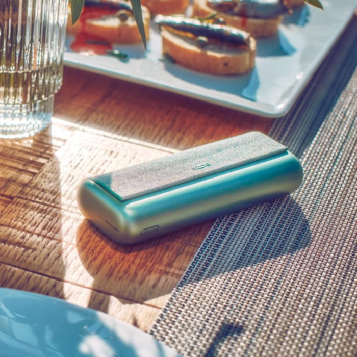 A Jade Green IQOS ILUMA PRIME Pocket Charger.  A Jade Green IQOS ILUMA PRIME Pocket Charger.