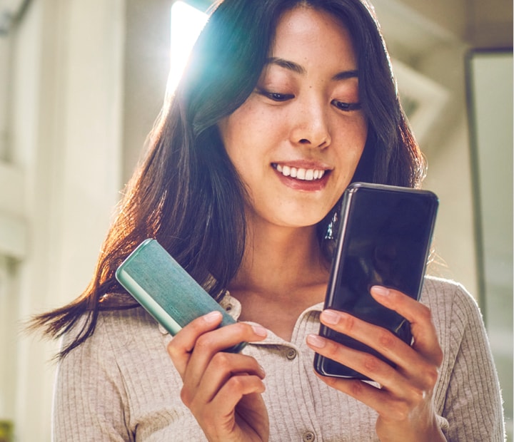 A Pebble Beige IQOS ILUMA Pocket Charger and Holder. 