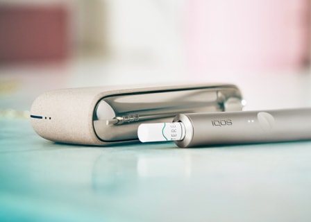 IQOS ILUMA device in pebble beige