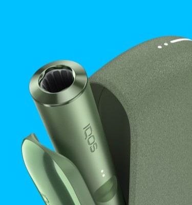 A Moss Green IQOS ILUMA device inside a Pocket Charger with its door open.