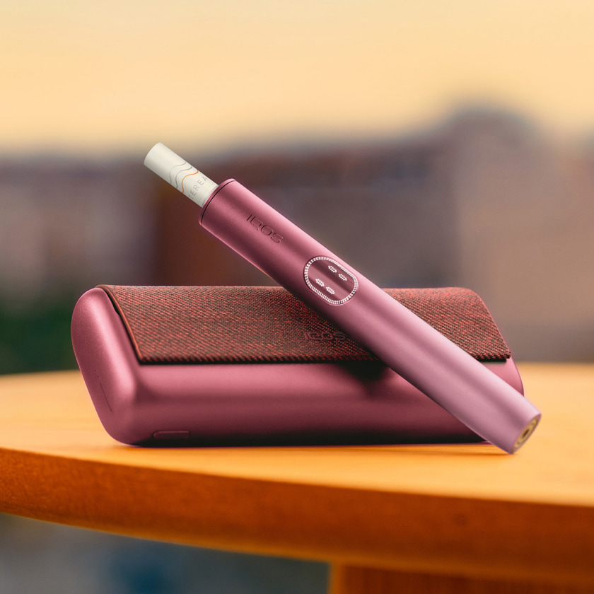 A Jade Green IQOS ILUMA PRIME Pocket Charger. 