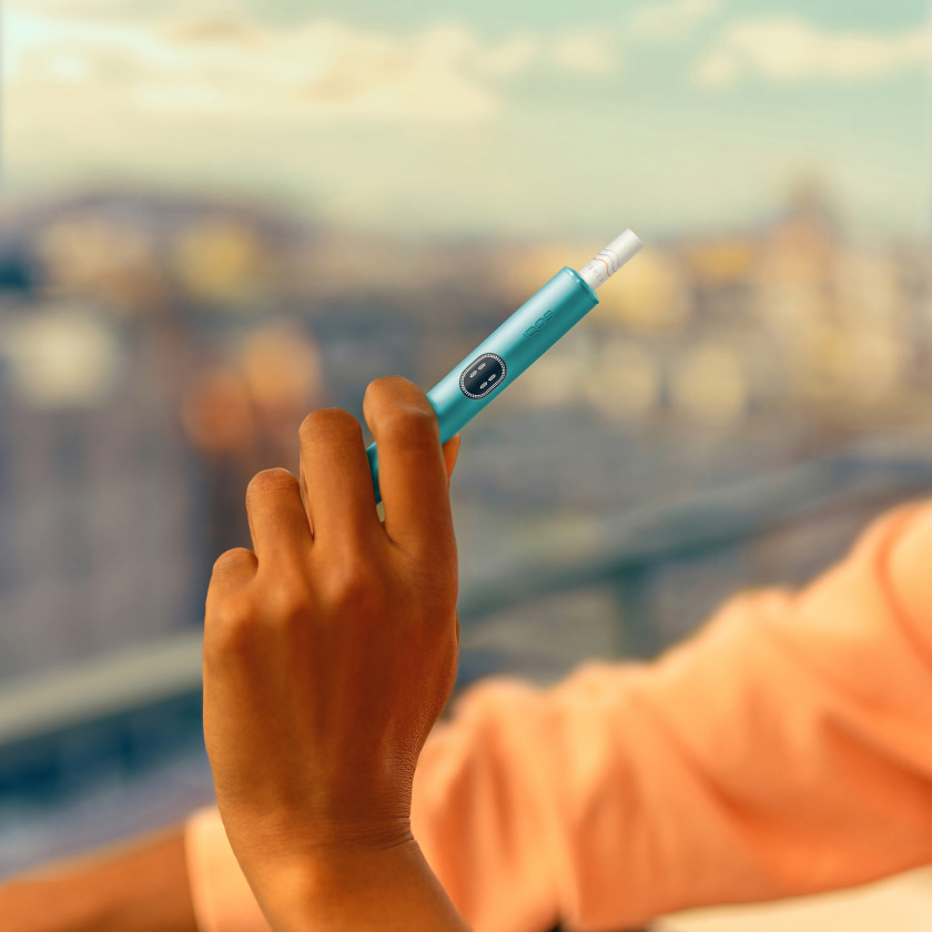 A Jade Green IQOS ILUMA PRIME Pocket Charger. 