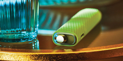 Folded hands in front a laptop.