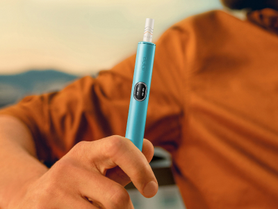 Folded hands in front a laptop.