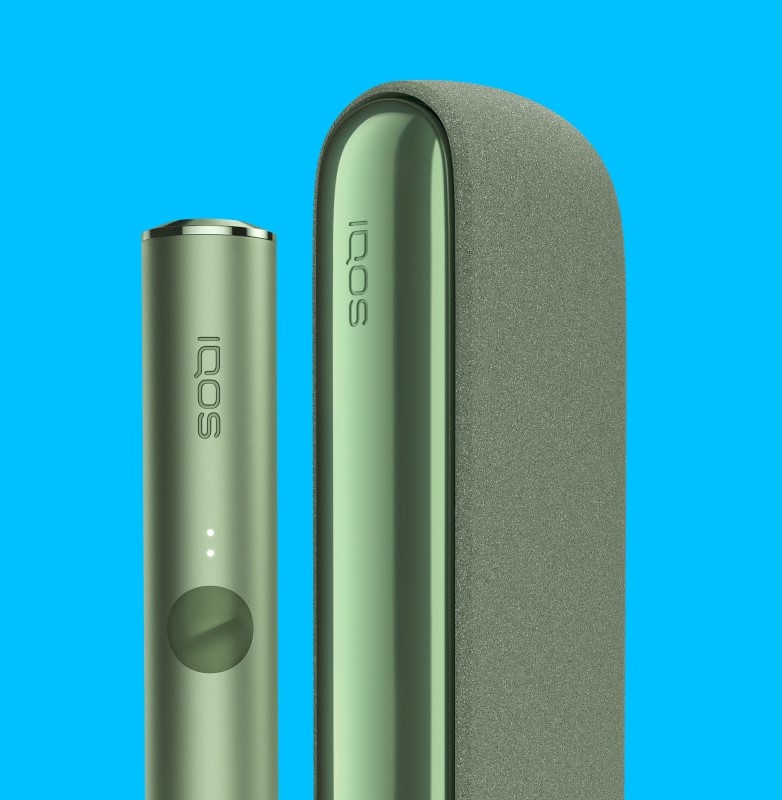 A Moss Green IQOS ILUMA device and Pocket Charger.