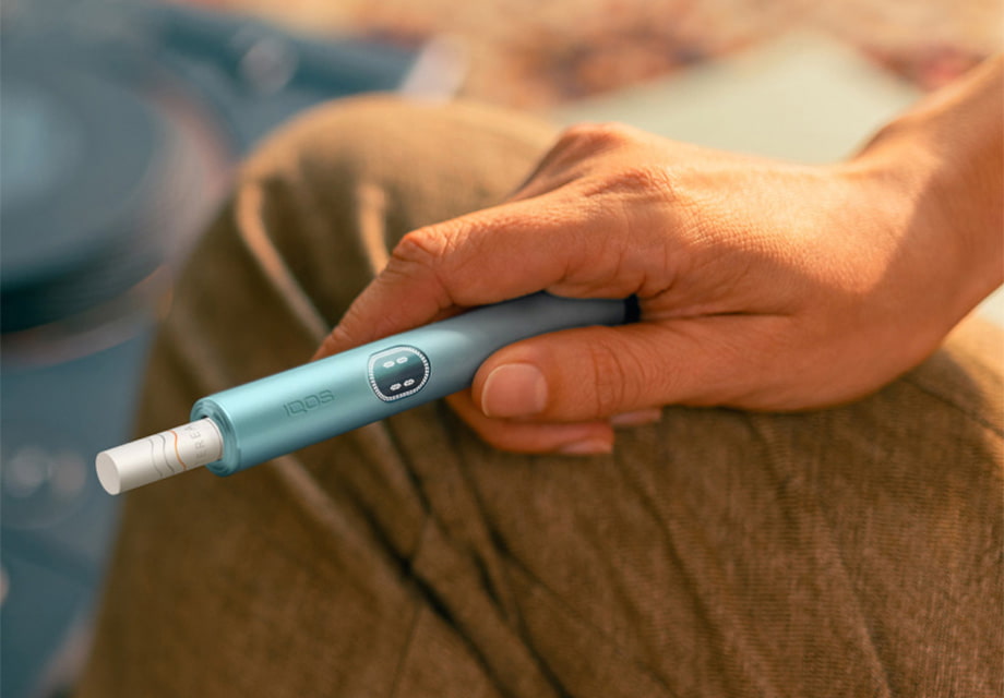 What are IQOS heated tobacco devices?
